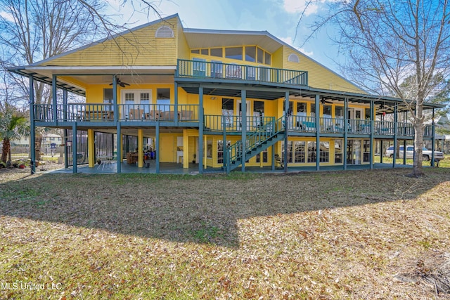 6132 Shawnee St, Kiln, MS 39556 - back of property with a ceiling fan, a deck, a patio area, and stairs