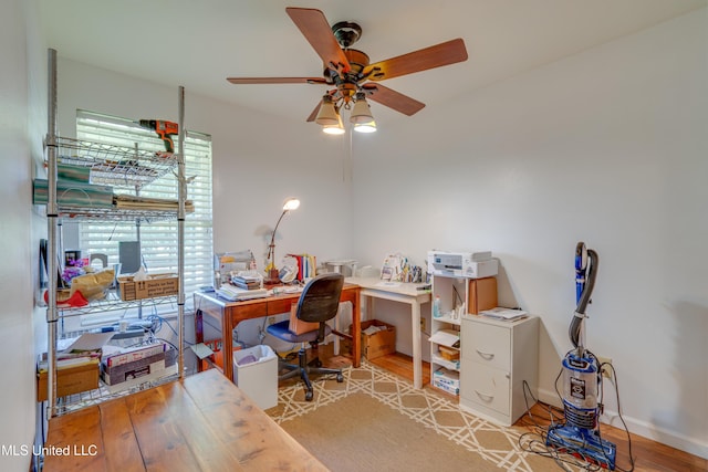 6132 Shawnee St, Kiln, MS 39556 - office area with light wood-style floors and ceiling fan