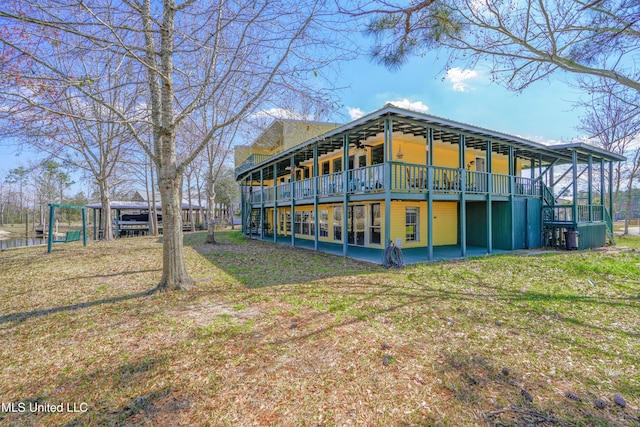 6132 Shawnee St, Kiln, MS 39556 - back of house with a deck, a ceiling fan, and stairs