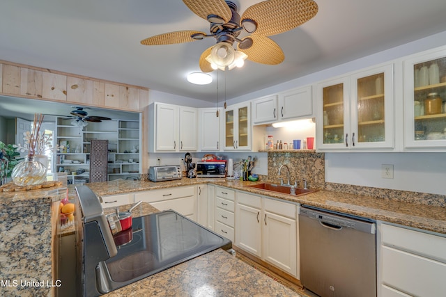 6132 Shawnee St, Kiln, MS 39556 - kitchen featuring appliances with stainless steel finishes, a ceiling fan, white cabinetry, and glass insert cabinets