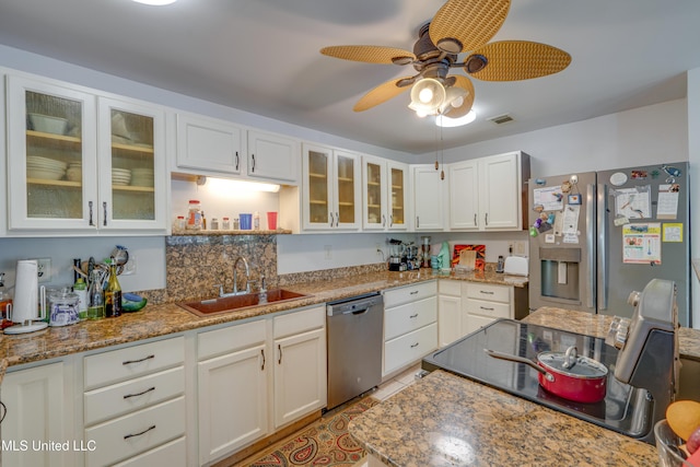 6132 Shawnee St, Kiln, MS 39556 - kitchen featuring stainless steel appliances, white cabinets, ceiling fan, glass insert cabinets, and open shelves