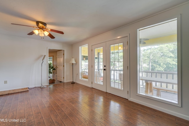 6132 Shawnee St, Kiln, MS 39556 - empty room with french doors, a ceiling fan, wood-type flooring, and ornamental molding