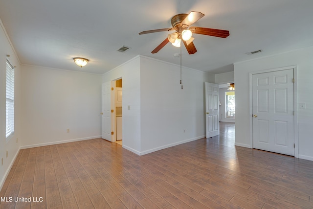 6132 Shawnee St, Kiln, MS 39556 - empty room featuring ceiling fan, ornamental molding, and wood finished floors
