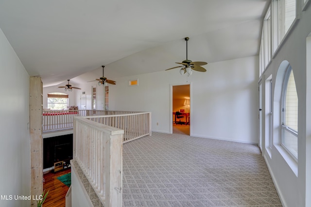 6132 Shawnee St, Kiln, MS 39556 - empty room with vaulted ceiling, ceiling fan, and carpet