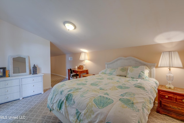 6132 Shawnee St, Kiln, MS 39556 - carpeted bedroom featuring vaulted ceiling and baseboards