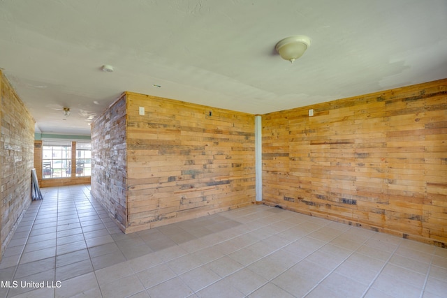 6132 Shawnee St, Kiln, MS 39556 - unfurnished room with tile patterned flooring and wooden walls