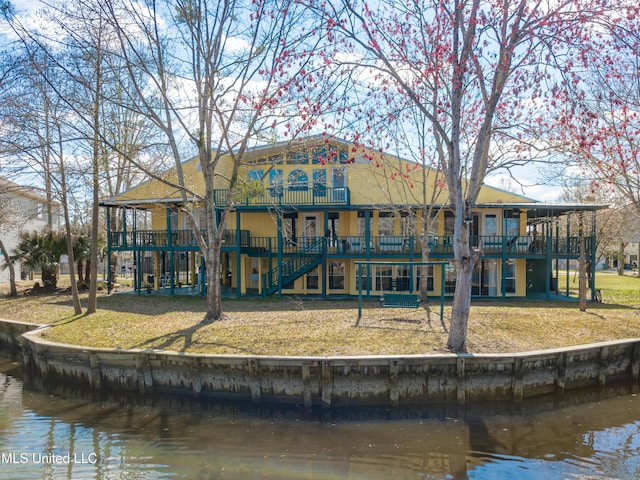 6132 Shawnee St, Kiln, MS 39556 - back of house with a deck with water view, a yard, stairs, and a patio area