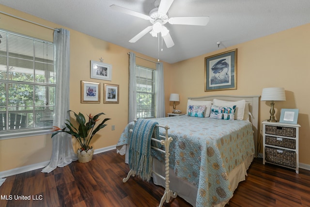 bedroom with dark wood-type flooring and ceiling fan