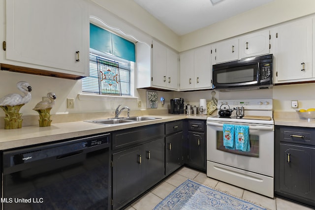 kitchen with sink, black appliances, white cabinets, and light tile patterned floors