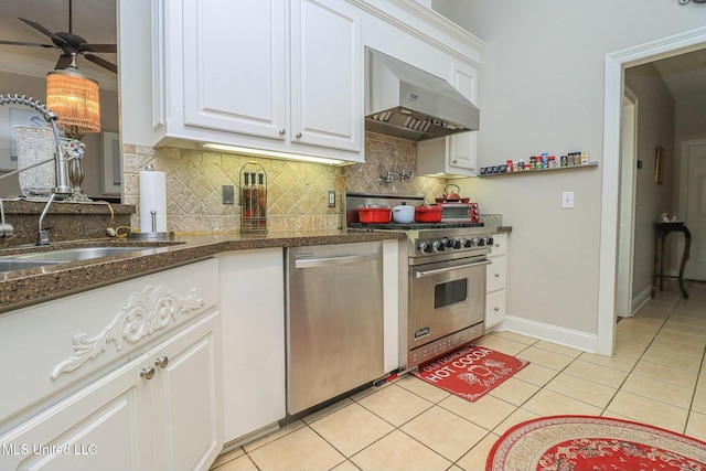 kitchen featuring white cabinets, wall chimney exhaust hood, decorative backsplash, light tile patterned flooring, and stainless steel appliances