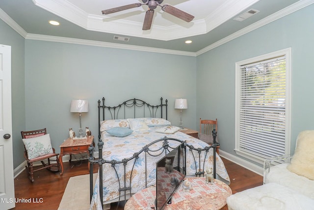 bedroom featuring a raised ceiling, ceiling fan, dark hardwood / wood-style flooring, and crown molding