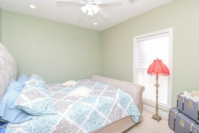 bedroom featuring ceiling fan and light colored carpet