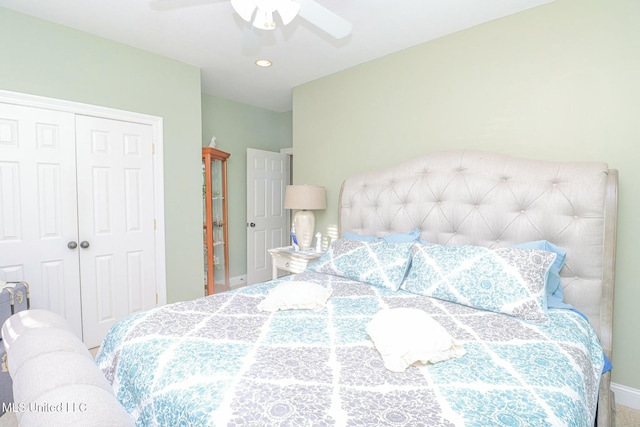 bedroom with ceiling fan, a closet, and carpet floors