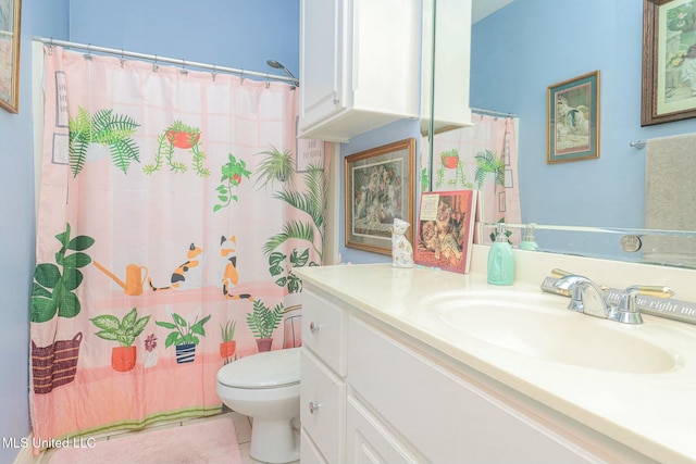 bathroom with tile patterned floors, vanity, and toilet