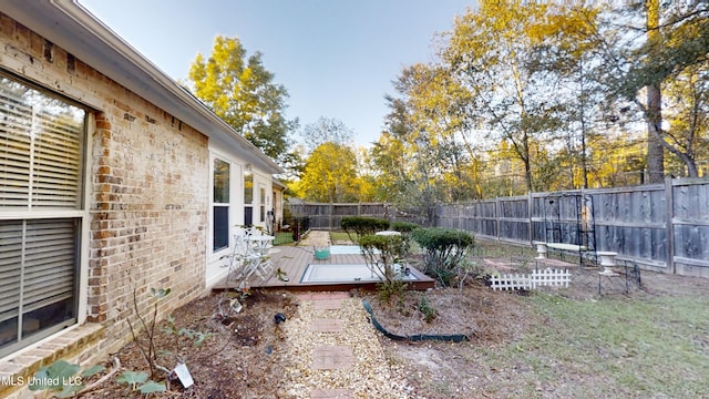 view of yard with a wooden deck