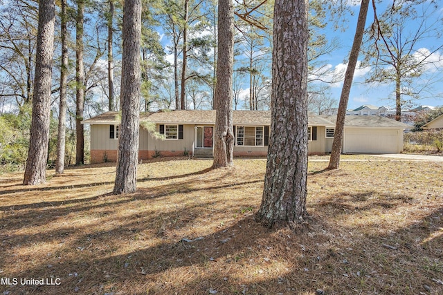 single story home featuring a garage