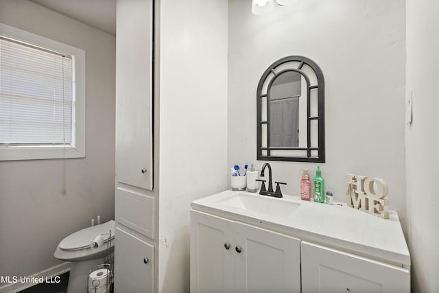 bathroom with vanity and toilet