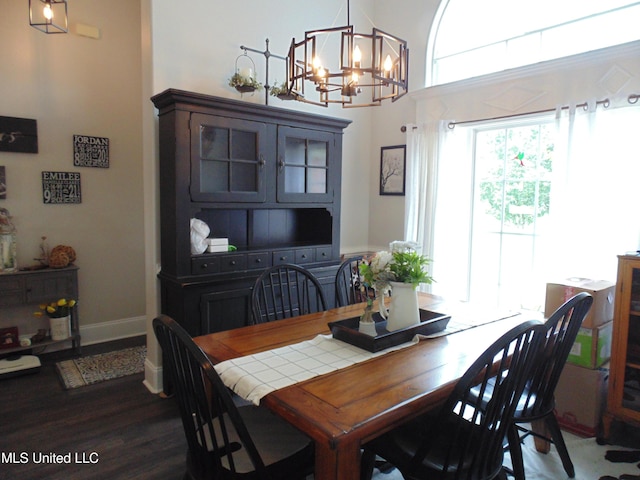 70 Tree Line Dr, Mount Pleasant, MS 38635 - dining space featuring a chandelier and dark wood-type flooring