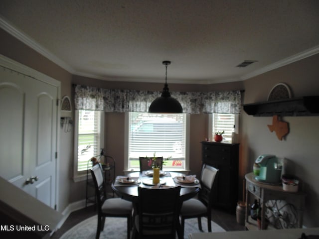 70 Tree Line Dr, Mount Pleasant, MS 38635 - dining room featuring ornamental molding, healthy amount of natural light, and wood finished floors