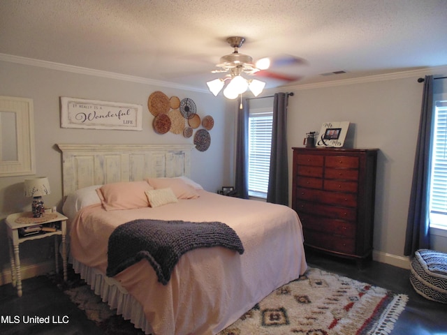 70 Tree Line Dr, Mount Pleasant, MS 38635 - bedroom featuring crown molding, multiple windows, a ceiling fan, and a textured ceiling