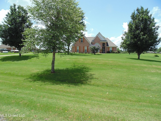 70 Tree Line Dr, Mount Pleasant, MS 38635 - view of green lawn