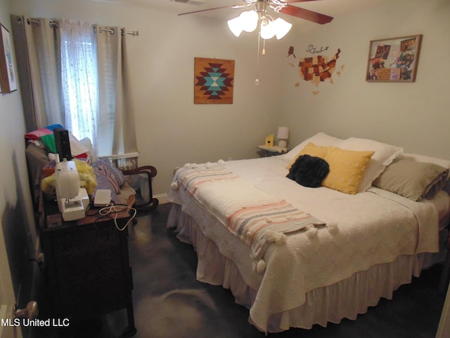 70 Tree Line Dr, Mount Pleasant, MS 38635 - bedroom with ceiling fan and baseboards