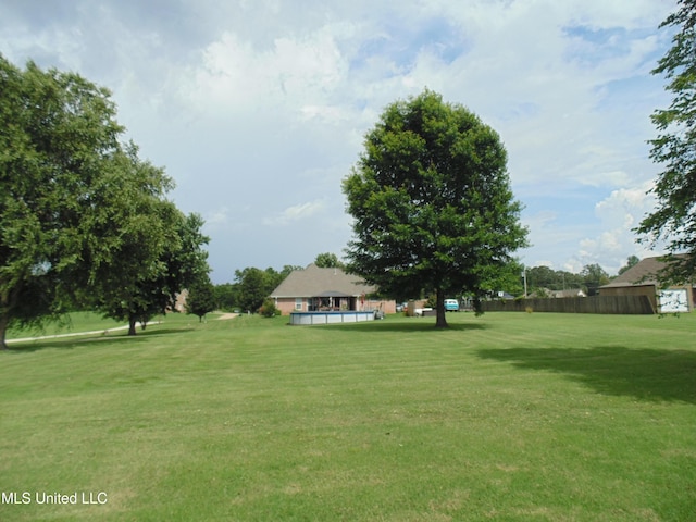 70 Tree Line Dr, Mount Pleasant, MS 38635 - view of grassy yard featuring an outdoor pool