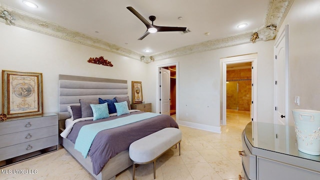 bedroom with ensuite bathroom and ceiling fan