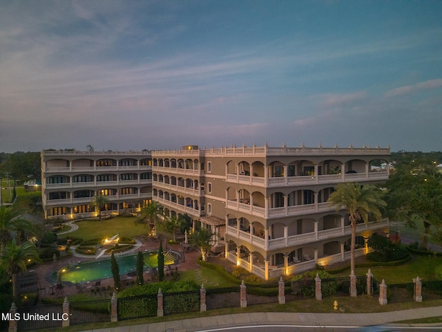 view of outdoor building at dusk