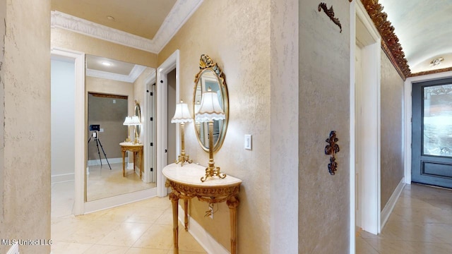 hallway with light tile patterned floors and ornamental molding