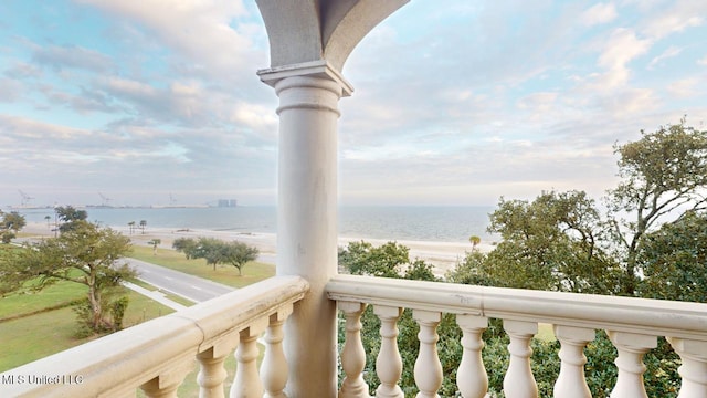 balcony featuring a water view