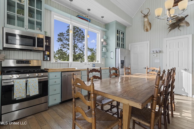 dining space featuring a chandelier and wood-type flooring