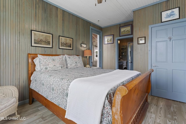 bedroom with wood finished floors and a ceiling fan