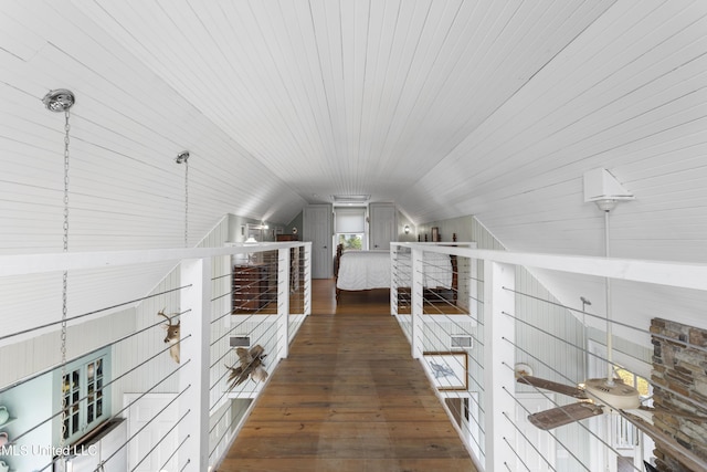 interior space with hardwood / wood-style floors and vaulted ceiling