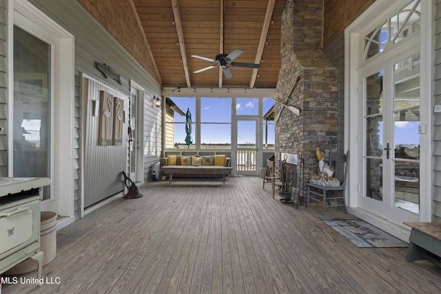 deck with a ceiling fan and french doors