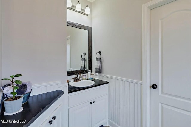 bathroom featuring wainscoting and vanity