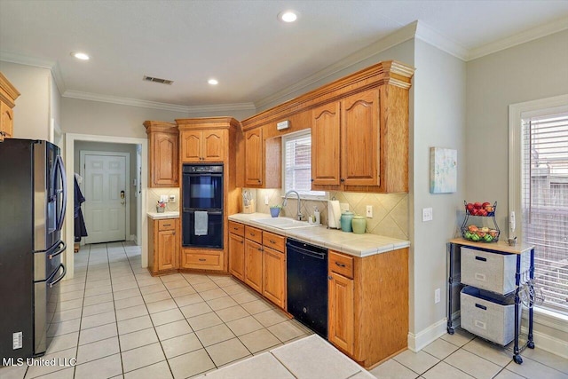 109 Bellemeade Trce, Clinton, MS 39056 - kitchen featuring black appliances, a sink, light tile patterned floors, backsplash, and crown molding