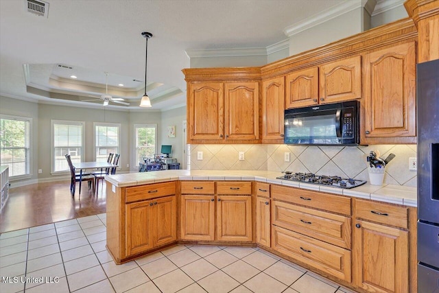 109 Bellemeade Trce, Clinton, MS 39056 - kitchen with black microwave, gas stovetop, ornamental molding, light tile patterned floors, and tasteful backsplash