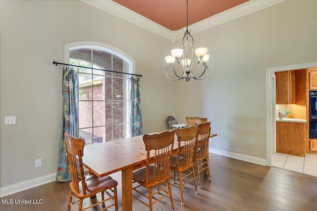 109 Bellemeade Trce, Clinton, MS 39056 - dining area with crown molding, a chandelier, wood finished floors, and baseboards