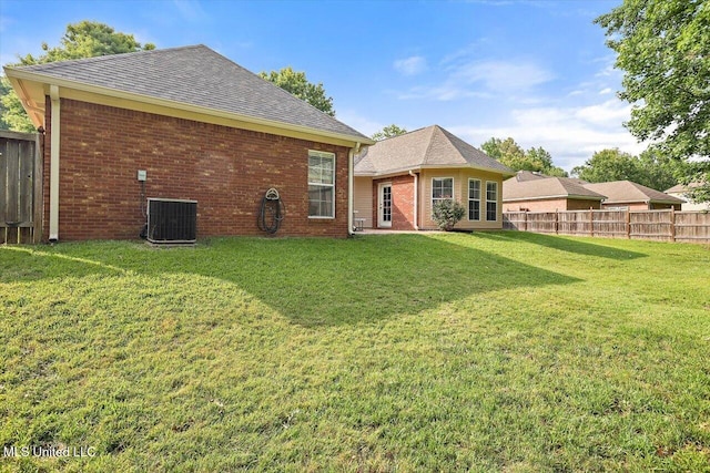 109 Bellemeade Trce, Clinton, MS 39056 - back of house featuring cooling unit, brick siding, and a shingled roof