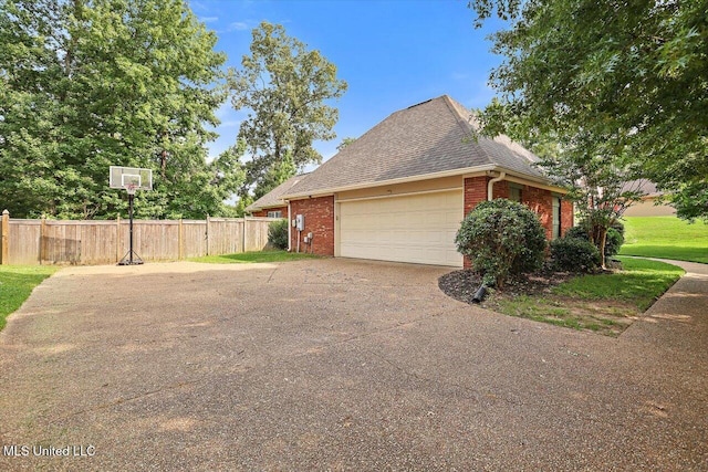 109 Bellemeade Trce, Clinton, MS 39056 - view of home's exterior featuring brick siding, roof with shingles, an attached garage, and driveway