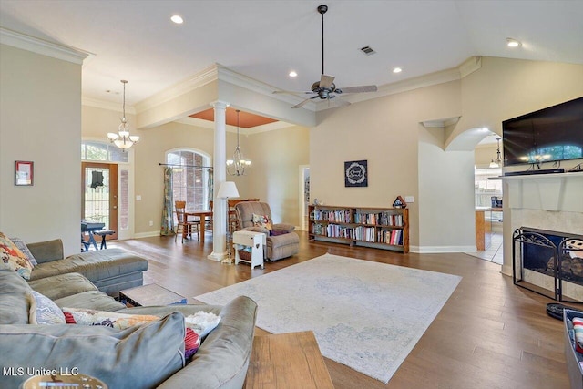 109 Bellemeade Trce, Clinton, MS 39056 - living room featuring a ceiling fan, a chandelier, baseboards, crown molding, and a tiled fireplace