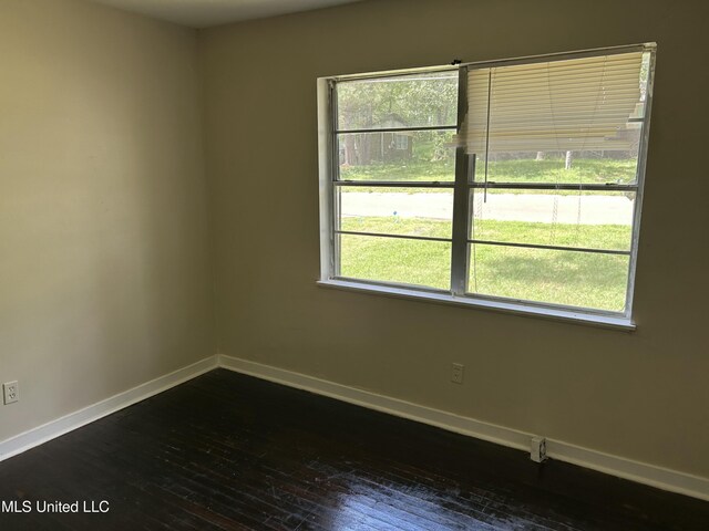 1110 Barbara Ann Dr, Jackson, MS 39204 - unfurnished room featuring dark wood-type flooring and baseboards