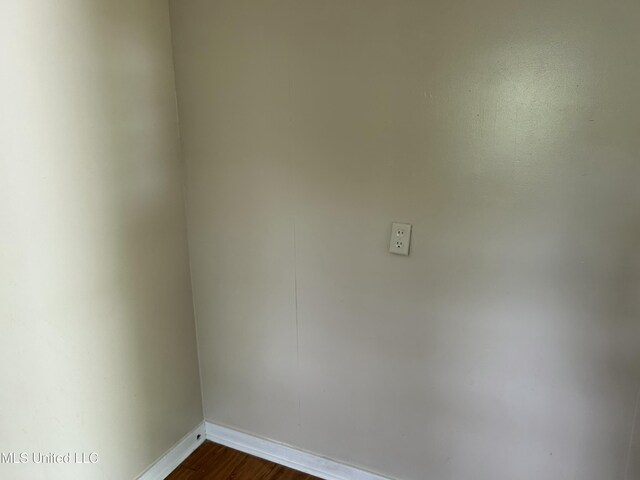 1110 Barbara Ann Dr, Jackson, MS 39204 - unfurnished room with dark wood-style flooring and baseboards