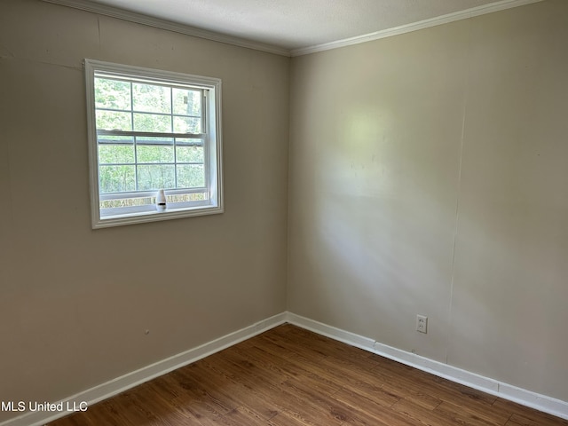 1110 Barbara Ann Dr, Jackson, MS 39204 - empty room featuring baseboards, ornamental molding, and dark wood finished floors