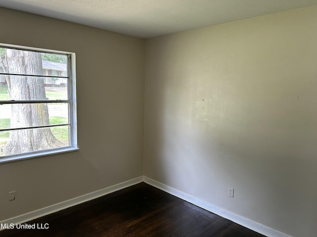 1110 Barbara Ann Dr, Jackson, MS 39204 - unfurnished room with dark wood-style flooring and baseboards