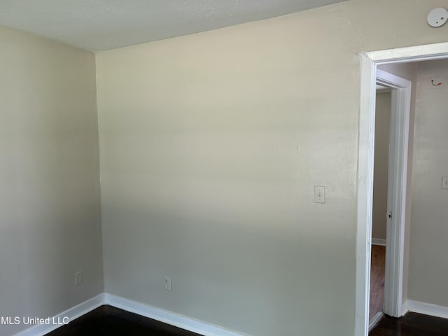 1110 Barbara Ann Dr, Jackson, MS 39204 - empty room featuring baseboards and dark wood finished floors