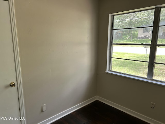 1110 Barbara Ann Dr, Jackson, MS 39204 - unfurnished room with baseboards and dark wood-style floors