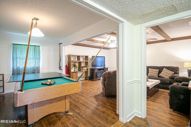 recreation room featuring beamed ceiling, billiards, a textured ceiling, and wood finished floors