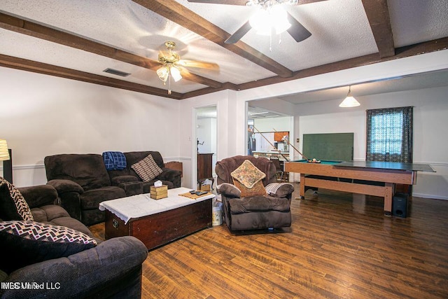 living room featuring visible vents, beam ceiling, ceiling fan, and wood finished floors
